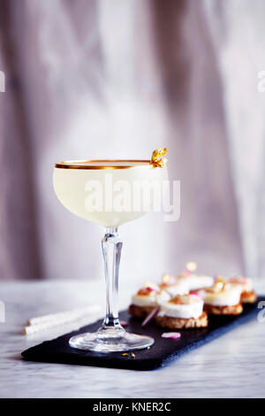 Toffee rum punch, with canapés Stock Photo