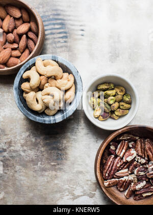 Variety of mixed nuts in bowls, close-up Stock Photo