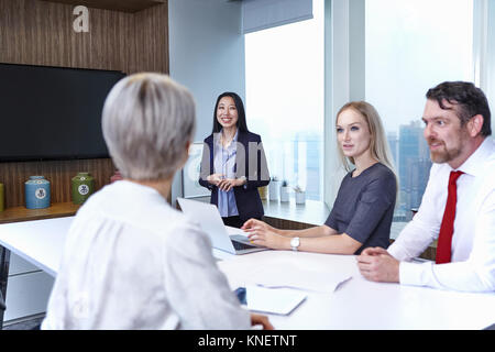 Colleagues at meeting in boardroom Stock Photo