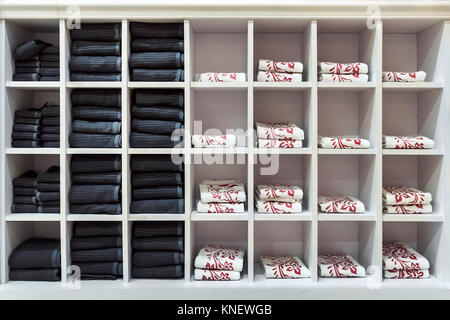 Clean towels every day in a square white shelf. Stock Photo