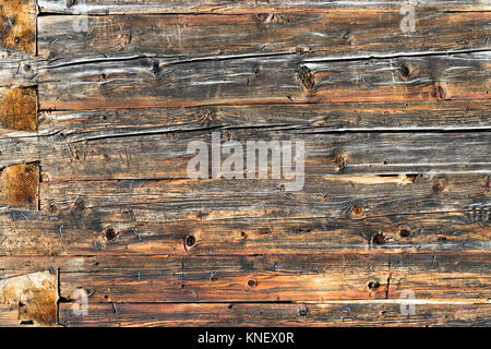 Old natural brown wood wall of log cabin. Wooden textured background pattern. Stock Photo