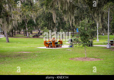 Group of Buddhist monks taking a travel break in picnic area along 1-75 in Georgia.