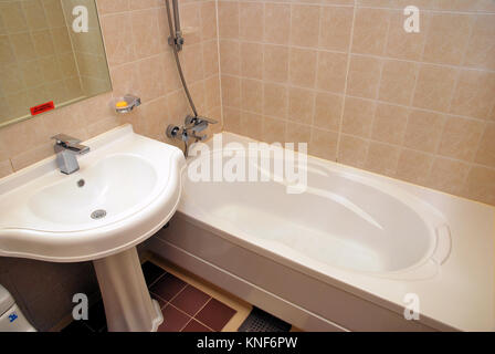 Bathtub in a luxurious hotel room. Suitable for concepts such as business and executive travel, tourism, vacation and holiday, spa, wellness and relax Stock Photo