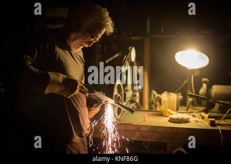 Man using welder in workshop Stock Photo