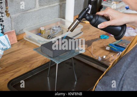 Jewellery maker, making jewellery in workshop, close-up Stock Photo