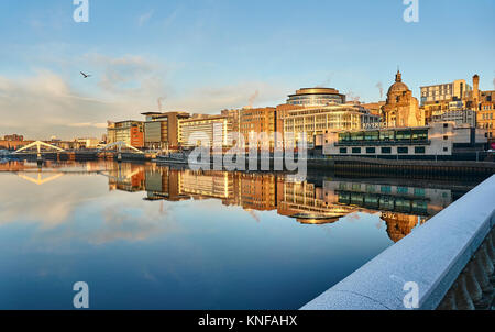 Glasgow, UK, 11th December 2017, Wintery sunrise in Glasgow city centre illuminating the riverside coorporate buildings in a beautiful orange glow. Stock Photo