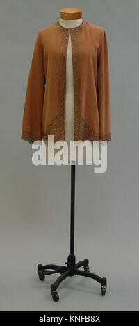 Coordinated Textile Design Elements Reference: This Ensemble Consists Of Coordinated Garments Showcasing Period