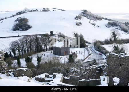 Snow-covered hills around the Holy Trinity Anglican church in Aghnahily, Co Laois. Stock Photo