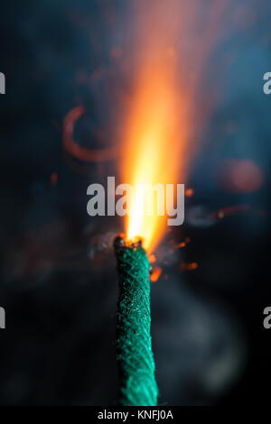 Burning fuse with sparks on black background Stock Photo - Alamy