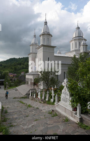 Wooden churches of Maramureș, Romania. New orthodox church is built close to the old one in Botiza. Stock Photo