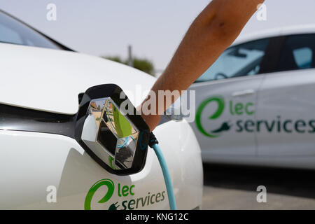 Handheld charging for electric vehicles Stock Photo