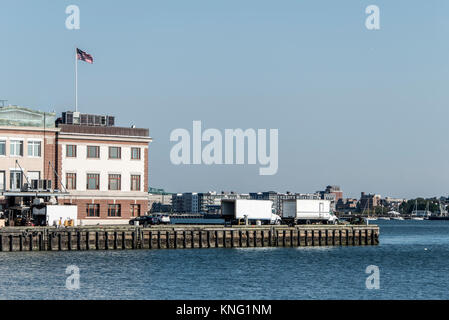 View of harbor from the Boston Waterfront with fishing boat trucks and boats anchored Massachusets USA Stock Photo