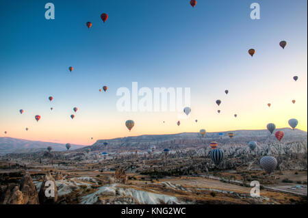 GOREME, TURKEY - OCTOBER 2017: Many hot air balloons fly every morning ...