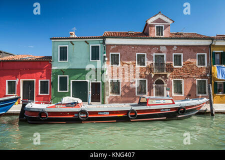 The colorful buildings, canals and boats in the Venetian village of Burano, Venice, Italy, Europe. Stock Photo