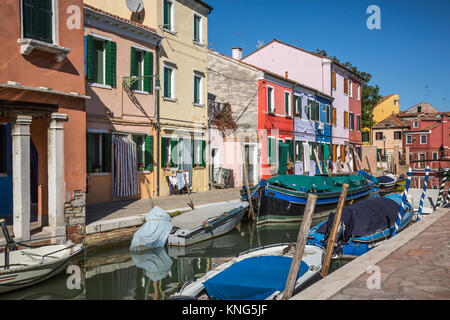 The colorful buildings, canals and boats in the Venetian village of Burano, Venice, Italy, Europe. Stock Photo