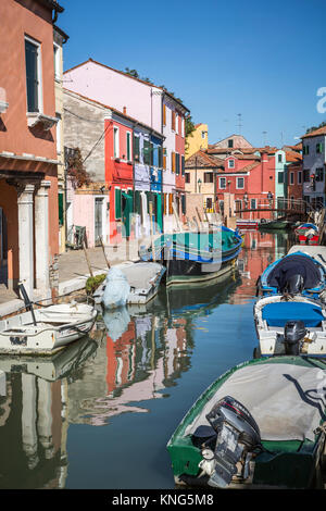 The colorful buildings, canals and boats in the Venetian village of Burano, Venice, Italy, Europe. Stock Photo