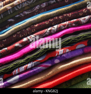 Colourful fabrics on a Spanish market stall on a sunny day Stock Photo