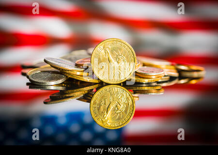 One dollar coin in front of usa flag. Stock Photo