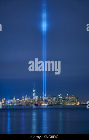 New York City skyline with skyscrapers and the two beams of the Tribute in Light. Lower Manhattan, Financial District, New York Harbor Stock Photo