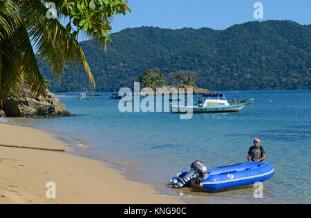 a Man at Ambatoloaka beach, Ampangorinana, Nosy Komba, north-western Madagascar, Africa Stock Photo