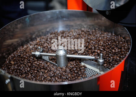 Freshly roasted coffee beans in a coffee roaster Stock Photo