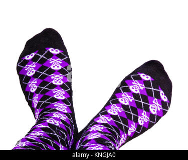 Fun purple and black socks with skulls on isolated white background Stock Photo