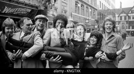 Children are to have their own Royal Variety Show each year, and outside the London Palladium are some of the stars who will appear in the event. (L-R) Keith Chegwin (TV's Swap Shop), Billy Dainty, Victor Spinetti, Lional Blair, Clive Webb (of TV show 'Tiswas'), Paul Daniels and Jim Davidson. The girl swept off her feet is Sally James, of Tiswas. Stock Photo