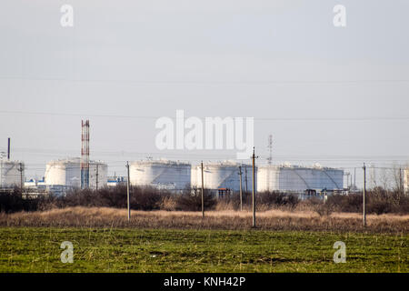 Refinery. Reservoirs for storage of refinery products. Rectification columns. Distillation columns, pipes and other equipment furnaces refinery. The o Stock Photo