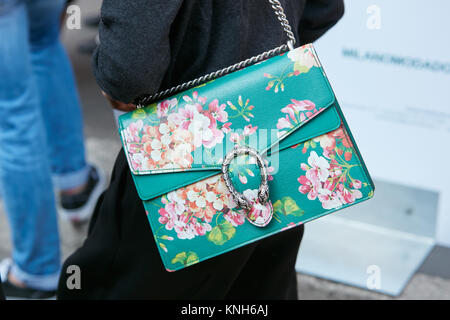 MILAN SEPTEMBER 24 Woman with green Gucci bag with floral