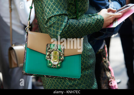 MILAN - SEPTEMBER 24: Woman with black Dolce and Gabbana bag with