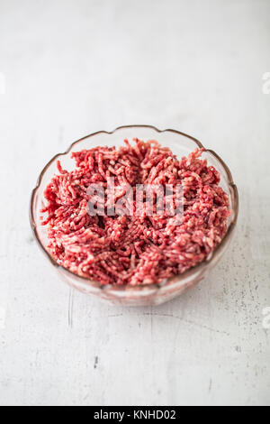 Minced beef pork or lamb meat in a glass bowl. Stock Photo