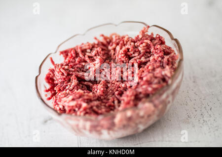 Minced beef pork or lamb meat in a glass bowl. Stock Photo