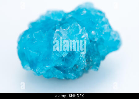 extreme close up of Chalcanthite mineral isolated over white background with shallow depth of field Stock Photo