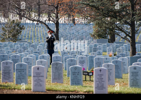 A U.S. Army Band bugler plays Taps during the graveside service for Special Forces soldier James Moriarty  at the Arlington National Cemetery December 5, 2016 in Arlington, Virginia. Moriarty was one of three Special Forces soldiers killed in Jordan in November. (photo by Rache Larue  via Planetpix) Stock Photo