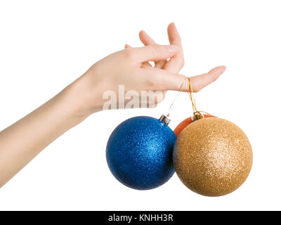 Woman hand holding glittered christmas balls. Isolated on white Stock Photo