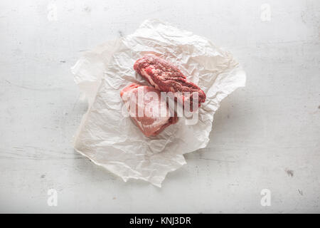Beef and pork meat on white concrete background. Stock Photo