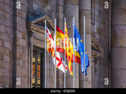 Colorful Flags on Old Spanish Government Building Stock Photo