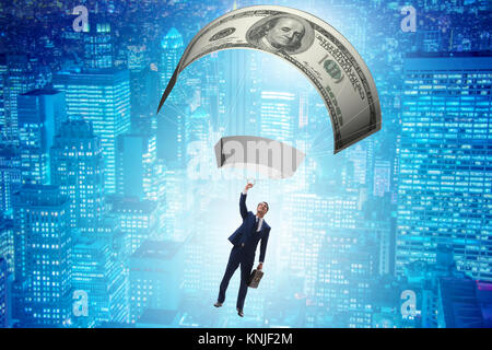 Businessman in golden parachute concept Stock Photo