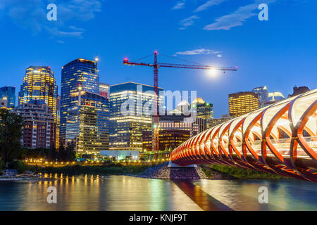 Beautiful view of Calgary downtown with Peace Bridge over Bow river, Alberta, Canada