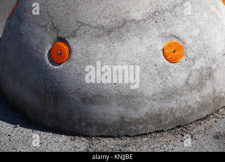 Berlin, Germany. 03rd May, 2015. A concrete block with two reflecting dots creates the shape of a face, photographed in Berlin, Germany, 03 May 2015. Credit: Wolfram Steinberg/dpa/Alamy Live News Stock Photo