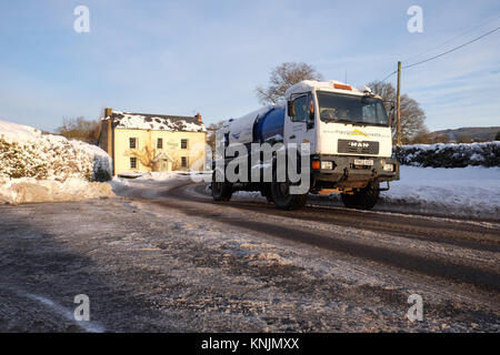 Titley, Herefordshire, UK - December 2017 - Overnight temperatures dropped to minus 9c ( -9c ) in the rural parts of Herefordshire last night - an early morning sewage waste truck drives with care on the ice covered road through the village. Credit: Steven May/Alamy Live News Stock Photo