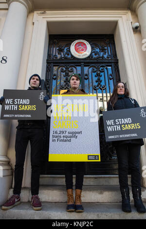 London, UK. 12th December, 2017. Amnesty International activists protest outside the Finnish embassy to call for revision of Finland’s ‘pre-historic’ trans sterilisation laws and in solidarity with Sakris Kupila, a 21-year-old Finnish human rights activist defending transgender rights and campaigning to change his country’s laws. Credit: Mark Kerrison/Alamy Live News Stock Photo