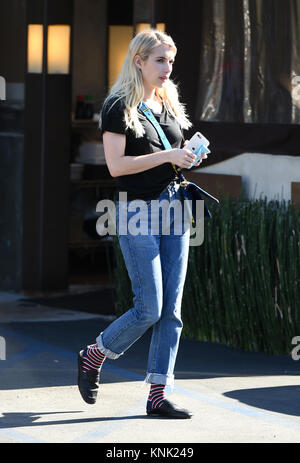 emma roberts wears a knitted yellow cardigan and denim shorts during a  shopping trip to louis vuitton in los angeles-080719_4