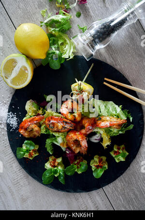 Barbecue grilled prawns with guacamole salad Stock Photo