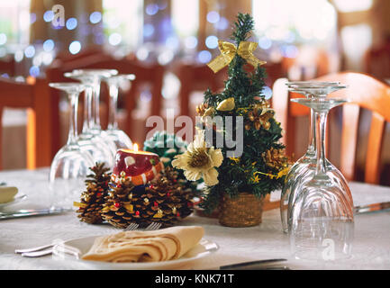 Table setting with Christmas decorations in a restaurant. Stock Photo