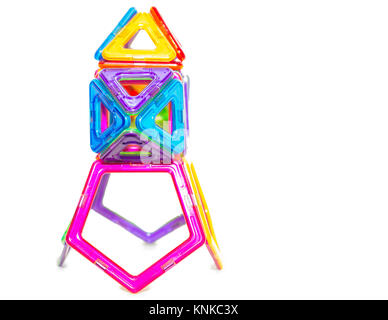 Multi-colored children's toy of interlocking plastic details isolated on white background Stock Photo