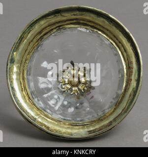 15th-century German covered cup made of rock crystal and gilt silver, decorated with glass cabochons and pearls, preserved for historical study and display. Stock Photo