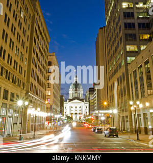 Indiana statehouse at night, long exposure with busy city streets in downtown Indianapolis, IN Stock Photo