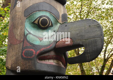 Details of a Tlingit totem pole that stands in Pioneer Square in the heart of Seattle Washington's historic district Stock Photo