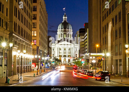 A dramatic view of the Indiana capitol building at night in Indianapolis, with busy streets and a long exposure Stock Photo